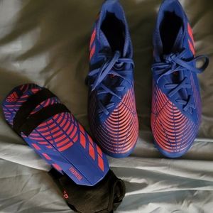 Boys size 4 FG Adidas soccer cleats with matching shin guards.